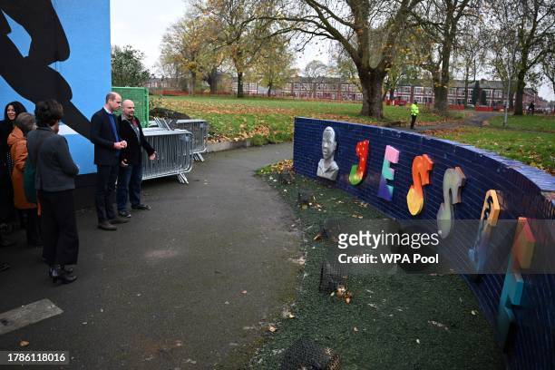 Britain's Prince William, Prince of Wales looks at Jessie's Wall, a memorial built in tribute of Jessie James, a teenager shot dead in 2006 in a park...