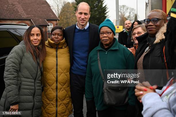 Britain's Prince William, Prince of Wales poses for pictures with Barbara Reid mother of Jessie James, a teenager shot dead in 2006 in a park in Moss...