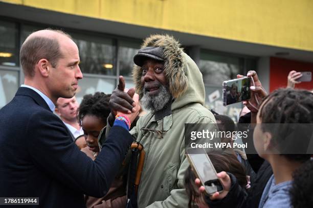 Britain's Prince William, Prince of Wales speaks with a well-wisher as he visits the Millennium Powerhouse, a multi-service youth hub which works...
