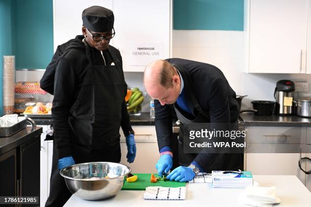 Britain's Prince William, Prince of Wales takes part in a cooking atelier as he visits the Millennium Powerhouse, a multi-service youth hub which...