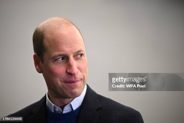 Britain's Prince William, Prince of Wales reacts as he visits the Millennium Powerhouse, a multi-service youth hub which works with a wide range of...
