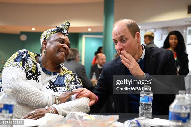 Britain's Prince William, Prince of Wales speaks with a member of the community during a visit of the Millennium Powerhouse, a multi-service youth...
