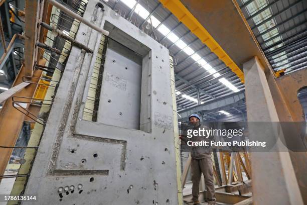 Man works in a factory of prefab construction parts in Huaibei city in central China's Anhui province.