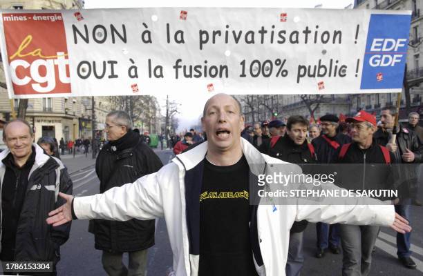 Protester gestures as he joins other fellow state workers from the French state-run railway company SNCF, the RATP, Paris Undergroud Transportation...