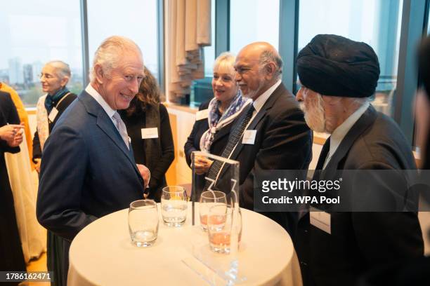 King Charles III speaks with faith leaders at a reception of faith leaders during a visit to the new Lambeth Palace Library to mark Inter Faith Week,...