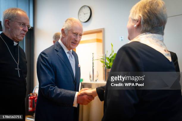 King Charles III speaks with faith leaders at a reception of faith leaders during a visit to the new Lambeth Palace Library to mark Inter Faith Week,...