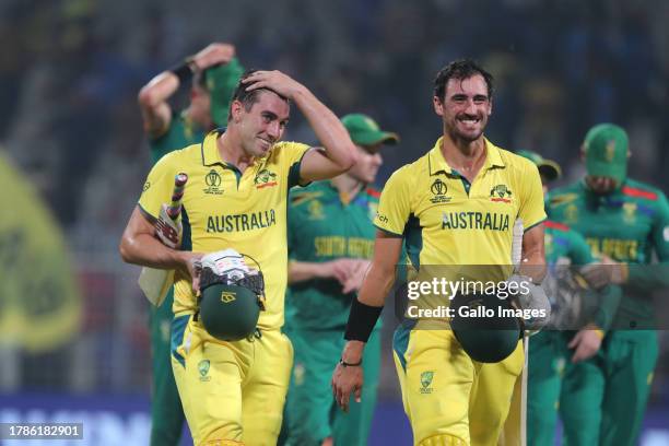 Australia's Mitchell Starc and Australia's captain Pat Cummins celebrate their team's win over South Africa during the ICC Men's Cricket World Cup...