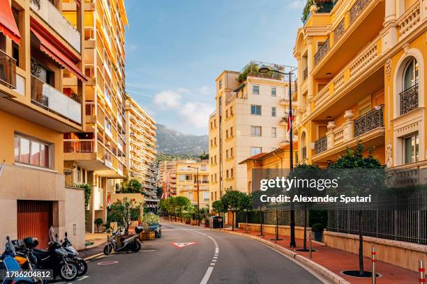 city street on a sunny day in la condamine, monaco - monaco skyline stock pictures, royalty-free photos & images