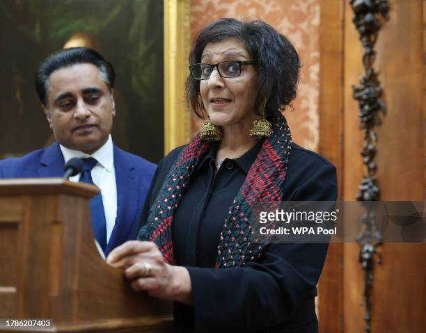 Sanjeev Bhaska listens as Meera Syal speaks at a reception hosted by Queen Camilla at Buckingham Palace for winners of The Queen's Commonwealth Essay...