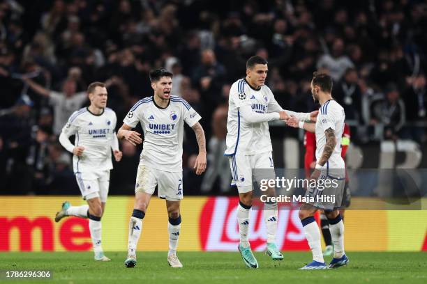 Mohamed Elyounoussi of F.C. Copenhagen celebrates with team mates after scoring the team's first goal during the UEFA Champions League match between...
