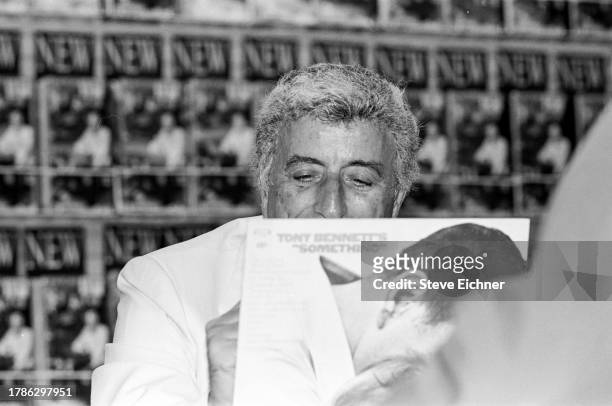 View of American Pop and Jazz musician Tony Bennett as he attends a CD release event at a Sam Goody record store, New York, New York, September 19,...