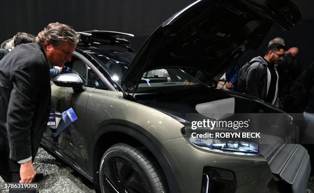 People look at the 2025 Lucid Gravity as it is unveiled at the Lucid press conference during Automobility LA, the media preview day for the 2023 LA...