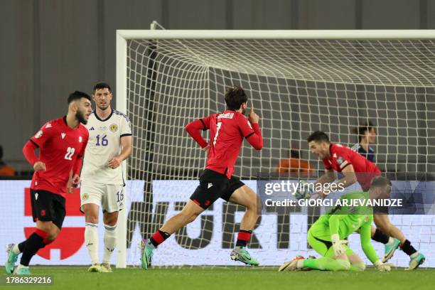 Georgia's midfielder Khvicha Kvaratskhelia celebrates after scoring the team's second goal during the UEFA Euro 2024 football tournament Group A...