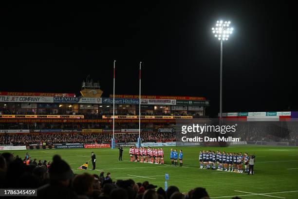 The players and match officials observe a minutes silence for Remembrance Day prior to the Gallagher Premiership Rugby match between Gloucester Rugby...