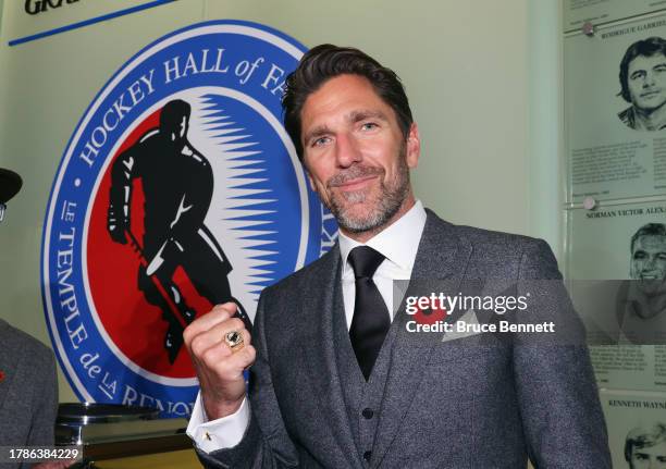 Henrik Lundqvist shows off his Hockey Hall of Fame ring at a press opportunity at the Hockey Hall Of Fame on November 10, 2023 in Toronto, Ontario,...