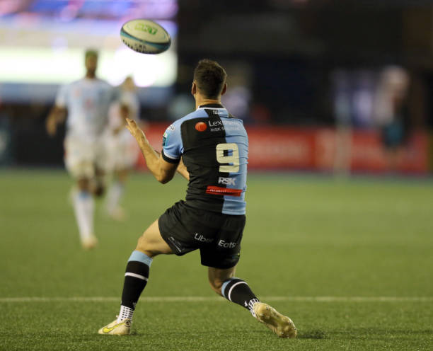 Tomos Williams of Cardiff Rugby takes the ball during the match between Cardiff Rugby and the Vodacom Bulls in the United Rugby Championship on...