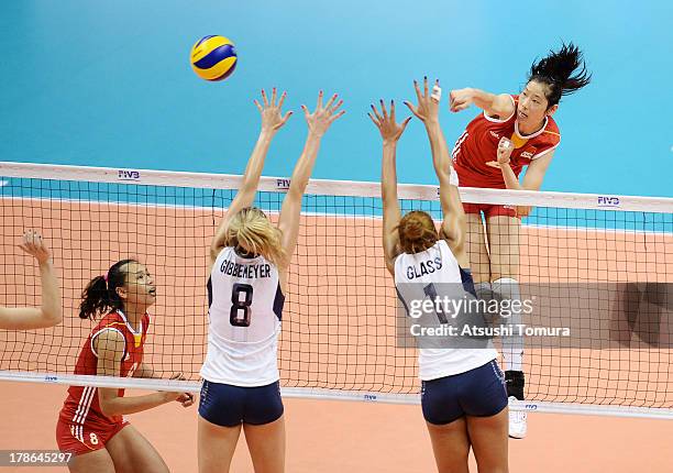 Ting Zhu of China spikes the ball during day three of the FIVB World Grand Prix Sapporo 2013 match between China and USA at Hokkaido Prefectural...