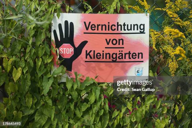 Sign outside a garden and cottage at the Oeynhausen Small Garden Association garden colony reads: "Stop The Destruction Of Small Gardens" on August...