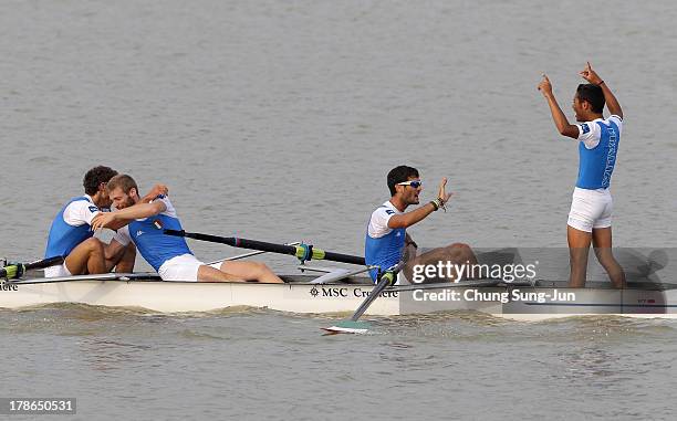 Enrico D'aniello, Paolo Di Girolamo, Francesco Schisano and Vincenzo Serpico of Italy celebrate after the Lightweight Men's Eight final during day...