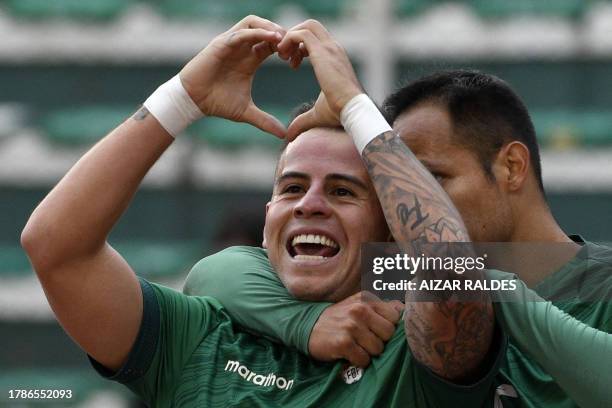 Bolivia's midfielder Henry Vaca celebrates with Bolivia's midfielder Leonel Justiniano after scoring during the 2026 FIFA World Cup South American...