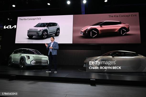 Kia America Vice President, Sales Operations Eric Watson unveils the Kia Concept EV3 and EV4 during the Kia press conference at Automobility LA, the...