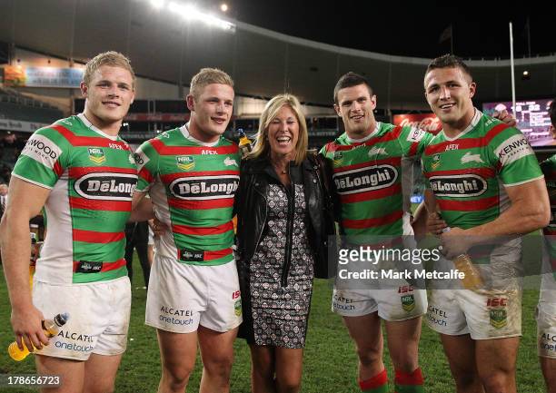 Thomas Burgess, George Burgess, Julie Burgess, Luke Burgess and Sam Burgess pose after the round 25 NRL match between the Wests Tigers and the South...