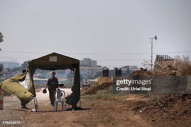 An Israeli soldier guards the 'Iron Dome' missile defense system on August 30, 2013 in Tel Aviv, Israel. Tensions are rising in Israel amid...