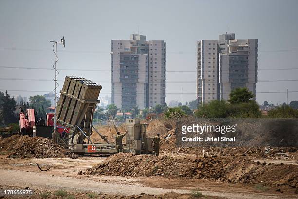 Israeli soldiers work on the 'Iron Dome' missile defense system on August 30, 2013 in Tel Aviv, Israel. Tensions are rising in Israel amid...