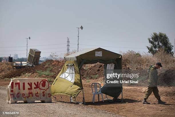 An Israeli soldier guards the 'Iron Dome' missile defense system on August 30, 2013 in Tel Aviv, Israel. Tensions are rising in Israel amid...