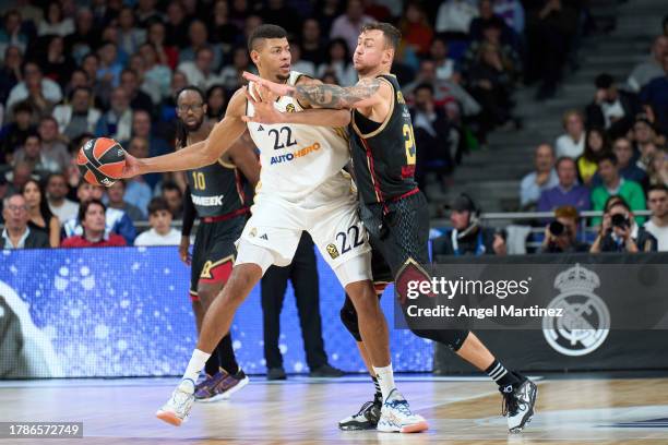 Walter Tavares, #22 of Real Madrid is challenged by Donatas Motiejunas, #20 of AS Monaco during the Turkish Airlines EuroLeague match between Real...