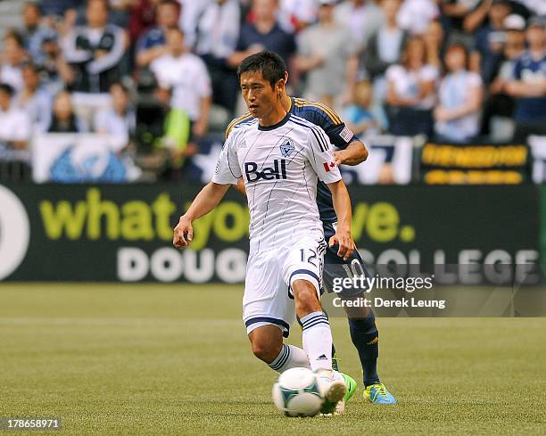 Young-Pyo Lee of the Vancouver Whitecaps in action during an MLS match against the Los Angeles Galaxy at B.C. Place on August 24, 2013 in Vancouver,...