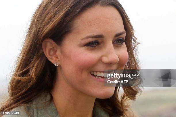 Britain's Catherine, Duchess of Cambridge talks with guests as she attends an event to start the Ring O' Fire Anglesey Coastal Ultra Marathon at...
