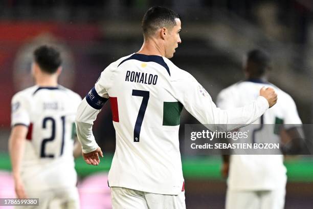 Portugal's forward Cristiano Ronaldo celebrates after opening the scoring during the UEFA Euro 2024 Group J qualification football match between...