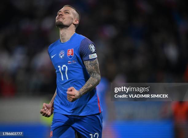 Slovakia's midfielder Lukas Haraslin celebrates scoring during the Euro 2024 football tournament group J first round qualifying match between...