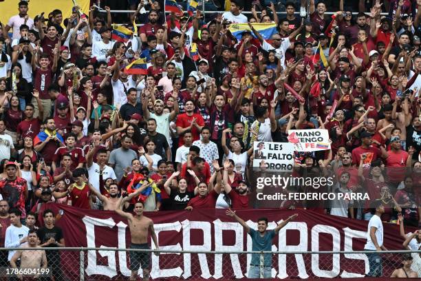 Fans of Venezuela cheer for their team before the start of the 2026 FIFA World Cup South American qualifiers football match between Venezuela and...