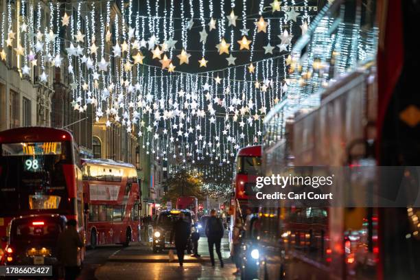 Christmas lights are displayed along Oxford Street on November 16, 2023 in London, England. Oxford Street took the lead in the seasonal light display...