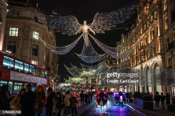 Christmas lights are displayed along Regent Street on November 16, 2023 in London, England. Oxford Street took the lead in the seasonal light display...