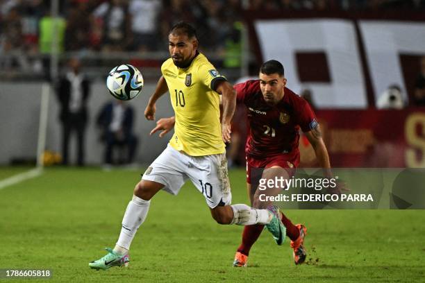 Ecuador's forward Junior Sornoza and Venezuela's defender Alexander Gonzalez fight for the ball during the 2026 FIFA World Cup South American...