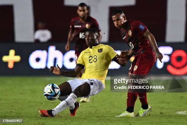 Ecuador's midfielder Moises Caicedo and Venezuela's midfielder Romulo Otero fight for the ball during the 2026 FIFA World Cup South American...