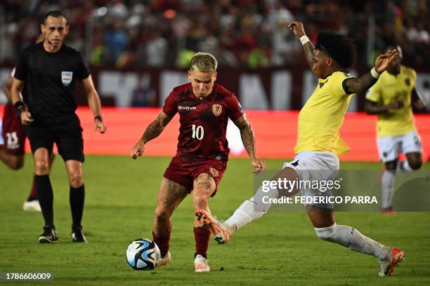 Venezuela's midfielder Yeferson Soteldo and Ecuador's defender Angelo Preciado fight for the ball during the 2026 FIFA World Cup South American...