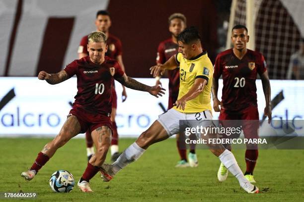 Venezuela's midfielder Yeferson Soteldo and Ecuador's midfielder Alan Franco fight for the ball during the 2026 FIFA World Cup South American...