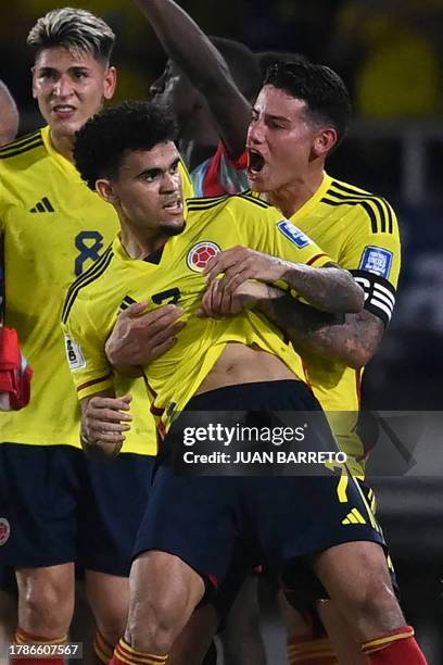 Colombia's forward Luis Diaz celebrates with midfielder James Rodriguez after scoring during the 2026 FIFA World Cup South American qualification...