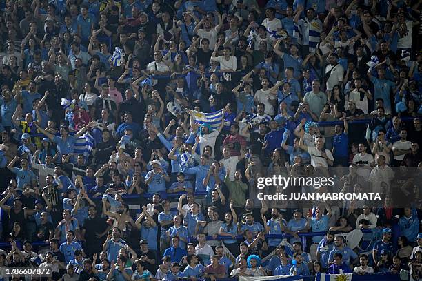 Fans of Uruguay celebrate after Darwin Nunez's goal during the 2026 FIFA World Cup South American qualification football match between Argentina and...