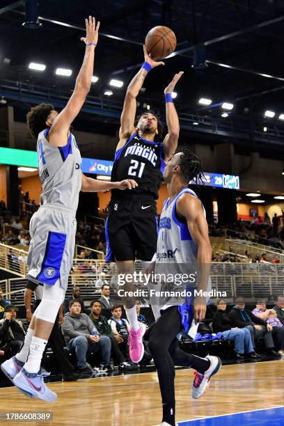 Trevelin Queen of the Osceola Magic shoots the ball against Justin Jackson and A.J. Lawson of the Texas Legends during the game on November 16, 2023...