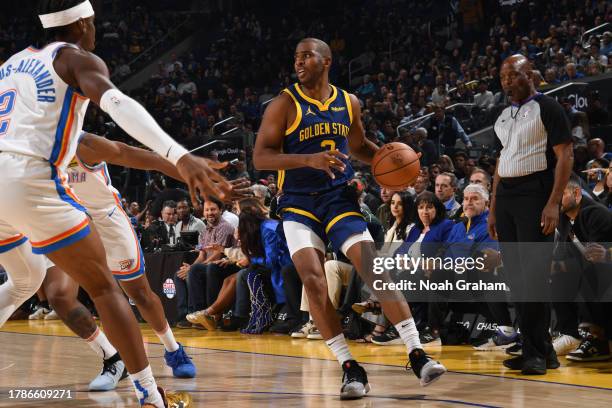 Chris Paul of the Golden State Warriors dribbles the ball during the game against the Oklahoma City Thunder on November 16, 2023 at Chase Center in...