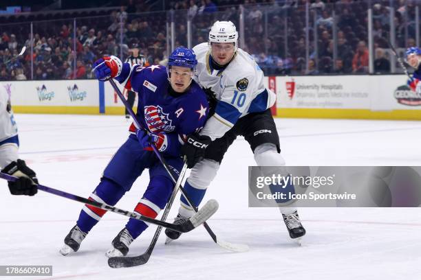 Cleveland Monsters center Brendan Gaunce defends Rochester Americans center Brandon Biro during the first period of the American Hockey League game...