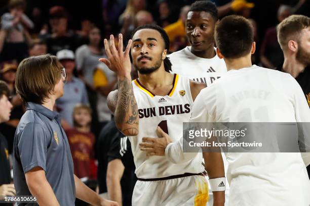 Arizona State Sun Devils guard Frankie Collins gestures after making the winning shot during the college basketball game between the UMass Lowell...
