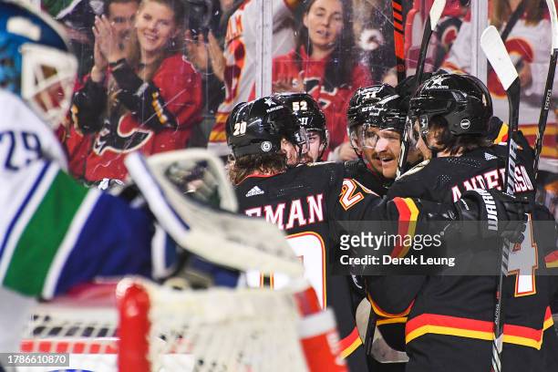 Jonathan Huberdeau of the Calgary Flames celebrates after scoring against Casey DeSmith of the Vancouver Canucks during the third period of an NHL...