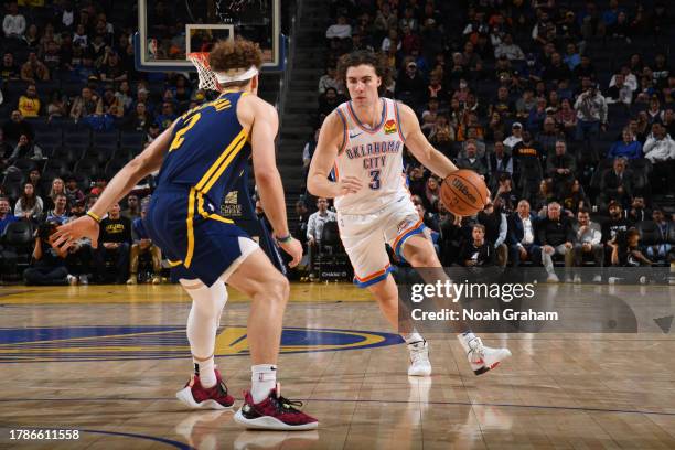 Josh Giddey of the Oklahoma City Thunder dribbles the ball during the game against the Golden State Warriors on November 16, 2023 at Chase Center in...