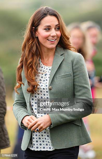 Catherine, Duchess of Cambridge attends the start of the Ring O'Fire Anglesey Costal Ultra Marathon on August 30, 2013 in Holyhead, Wales.